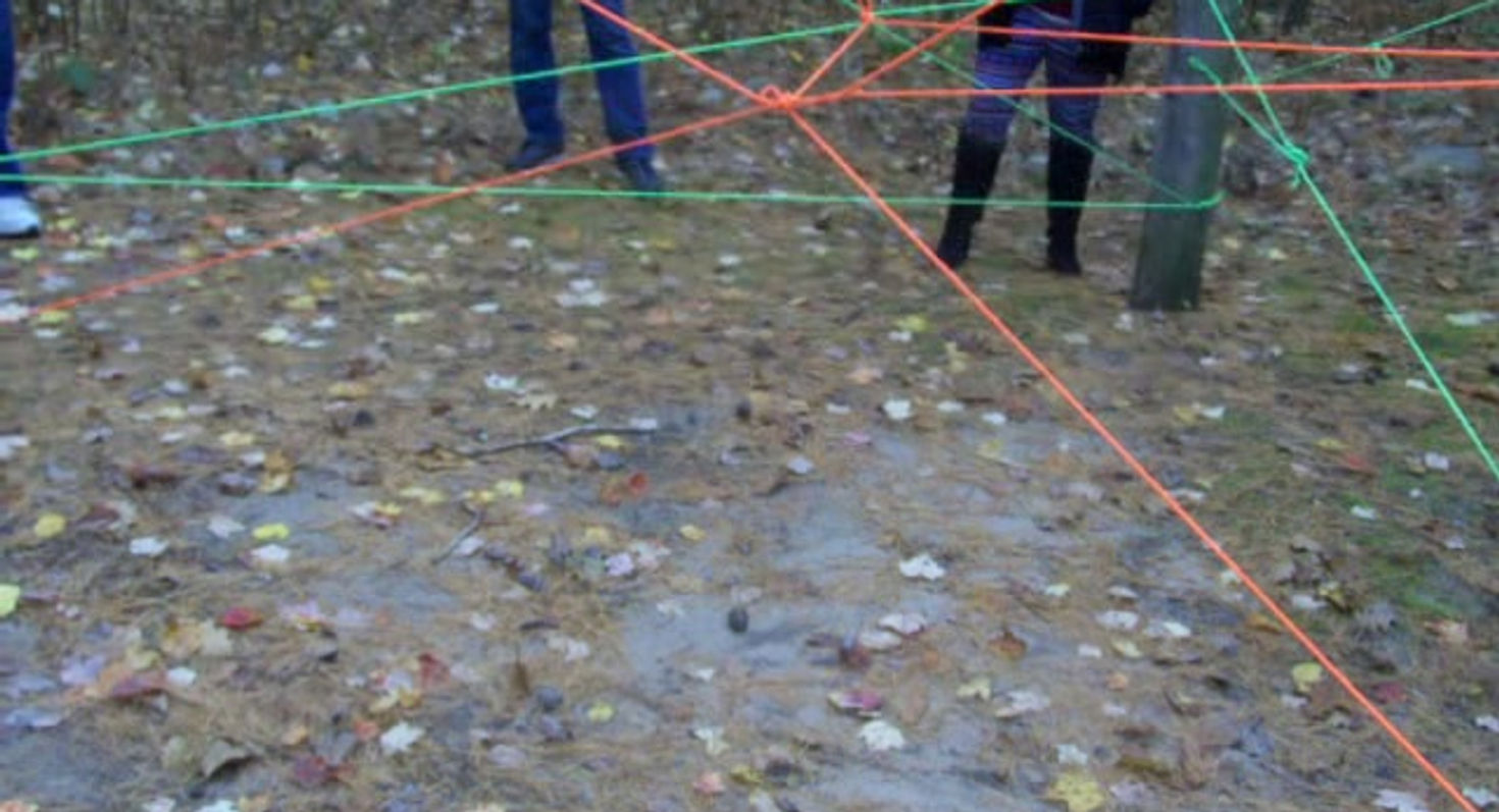 Spider Web Laser Game: Mick, Sue, Linda, and Tammy H. Go Through